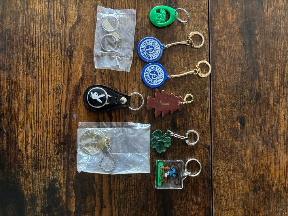 Vintage Assorted Keychain Collection - Playboy, Smurfs, Lions Club, and More